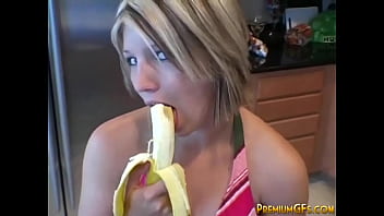 Young Girl Playfully Flirts With Banana Suggestively