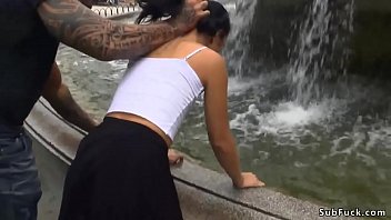 Slender Brunette Gets Drenched At City Fountain